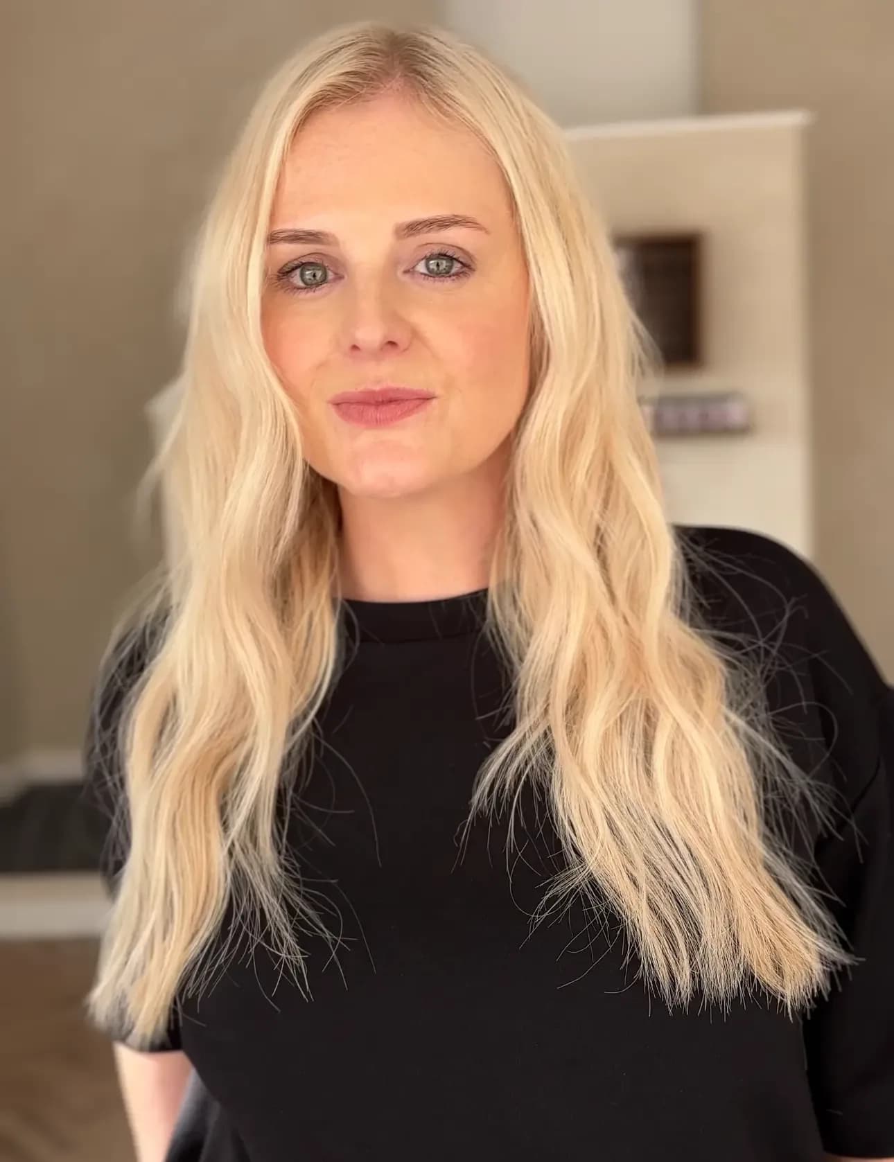 Happy client Carly showing discreet keratin bond extensions